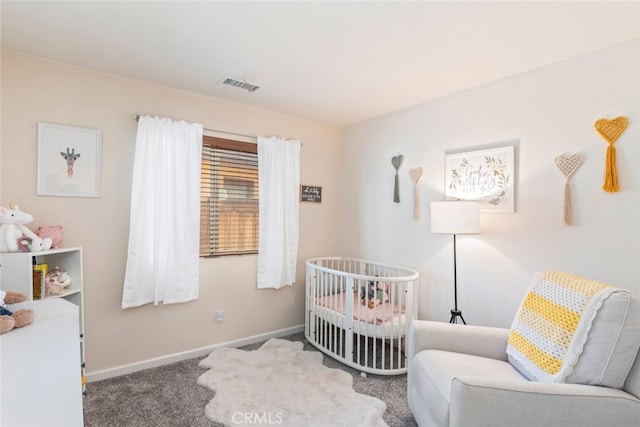 bedroom with carpet and a nursery area