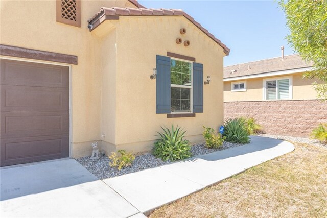 doorway to property featuring a garage