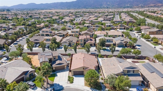 birds eye view of property featuring a mountain view