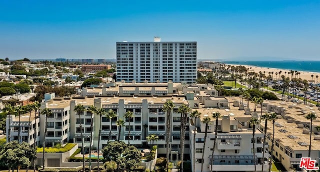 exterior space featuring a water view and a view of the beach