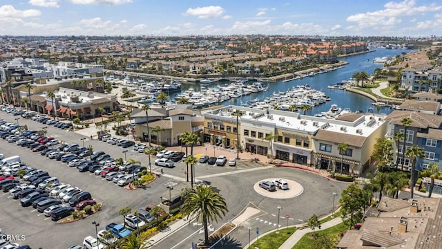 birds eye view of property with a water view