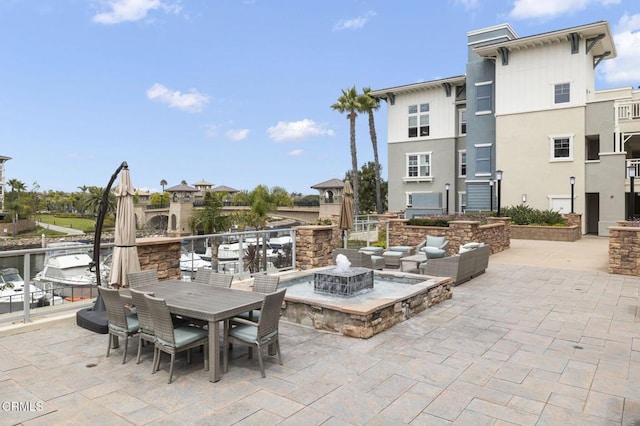 view of patio with an outdoor fire pit