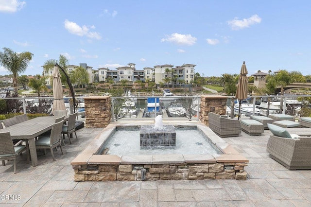 view of patio / terrace with pool water feature