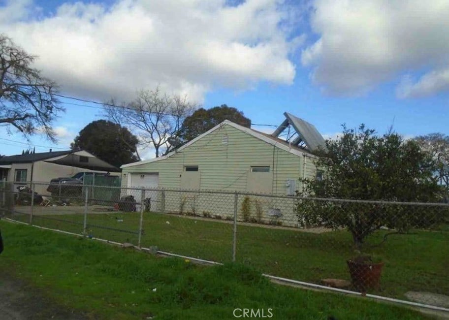 view of property exterior featuring a lawn