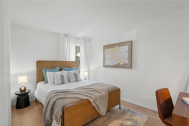 bedroom featuring light hardwood / wood-style floors