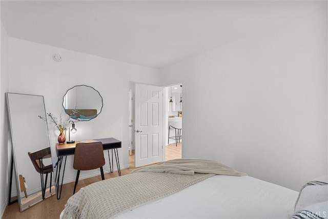 bedroom with wood-type flooring