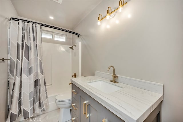 full bathroom with shower / bath combo with shower curtain, tile patterned flooring, vanity, and toilet