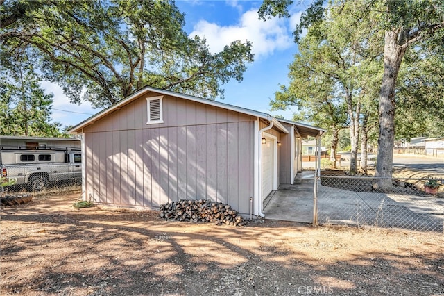 view of side of property featuring an outbuilding