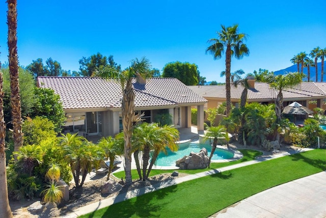 view of swimming pool featuring a yard and a patio