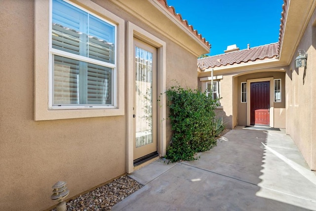 entrance to property with a patio area