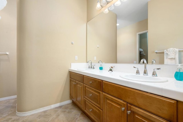 bathroom with vanity and tile patterned flooring