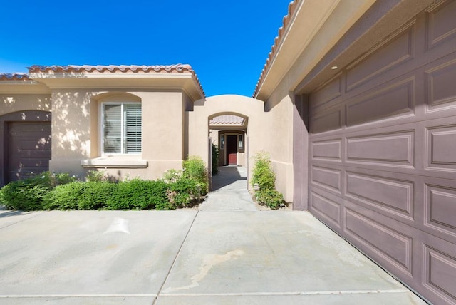 property entrance featuring a garage