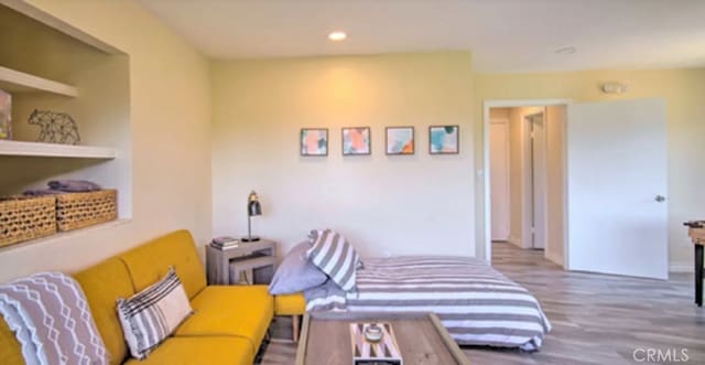 bedroom featuring hardwood / wood-style floors