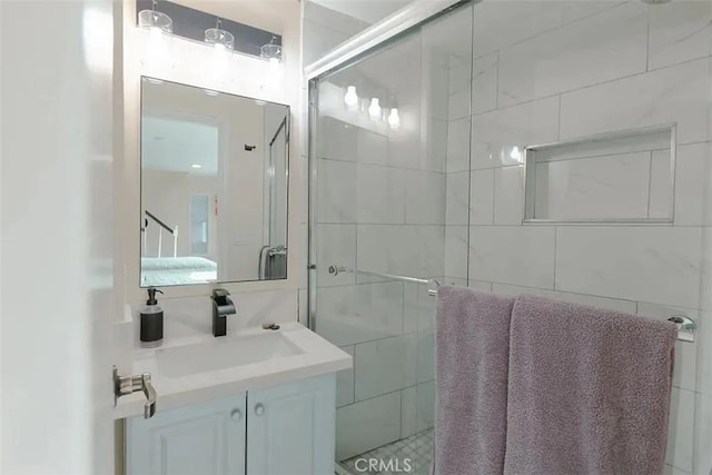 bathroom with vanity and walk in shower