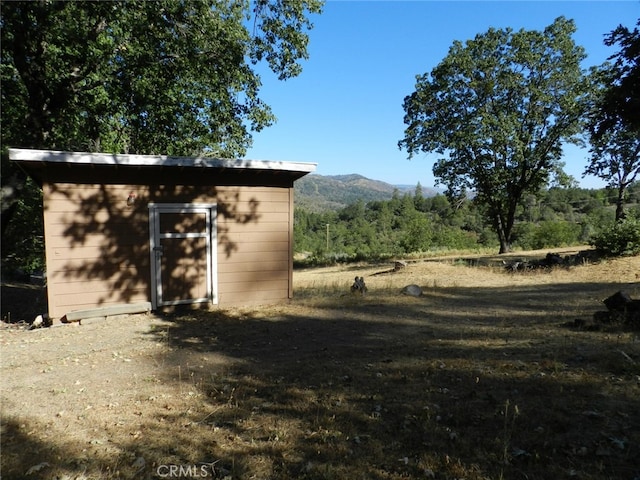 view of outdoor structure with a mountain view