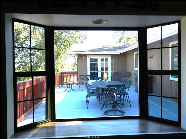 doorway to outside with french doors and a wealth of natural light