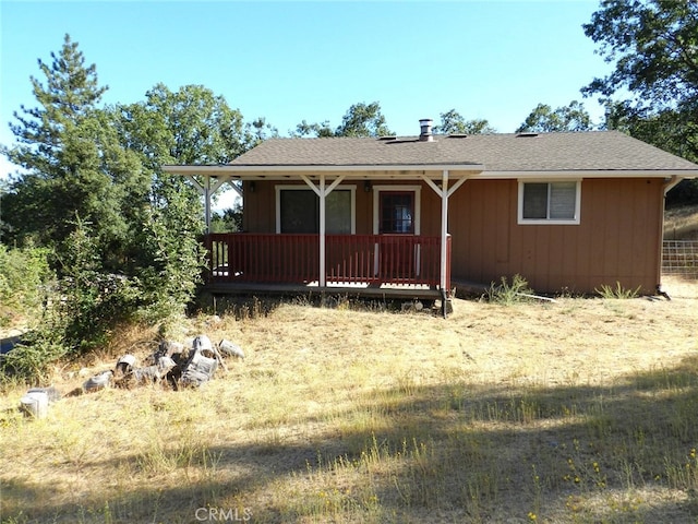 view of front facade with a wooden deck