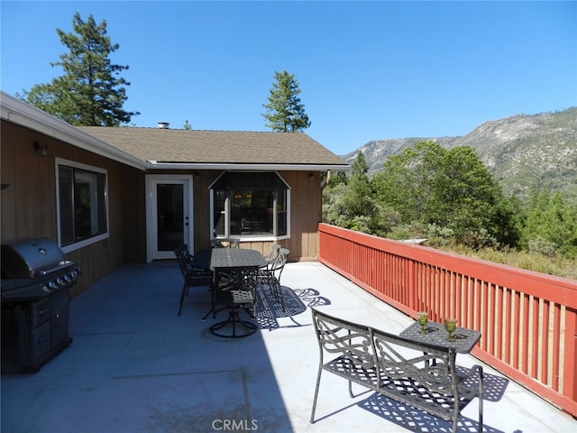 view of patio featuring a mountain view and area for grilling