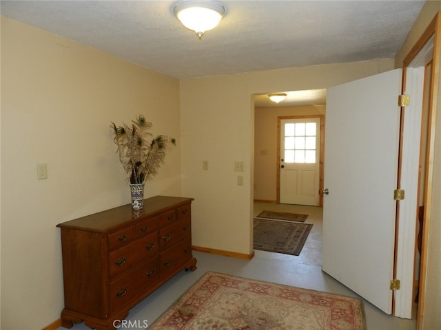 foyer with a textured ceiling