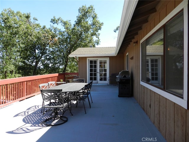 view of patio with french doors and a grill