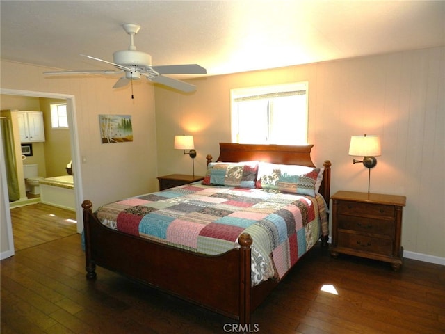 bedroom featuring ceiling fan, dark hardwood / wood-style flooring, and ensuite bathroom