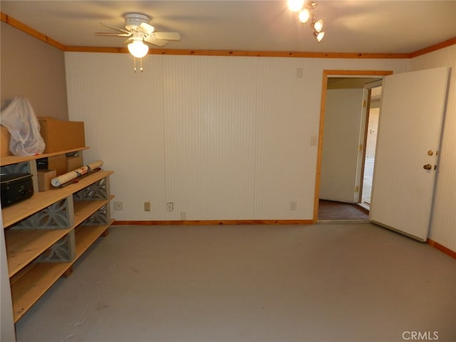 spare room with ornamental molding and ceiling fan