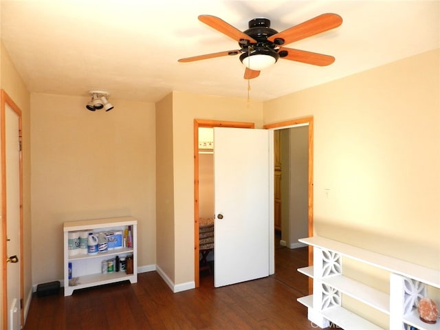 bedroom with ceiling fan and dark hardwood / wood-style floors