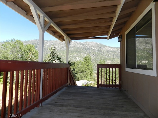 wooden terrace featuring a mountain view