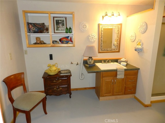 bathroom with vanity and concrete flooring