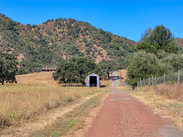 view of road featuring a rural view and a mountain view