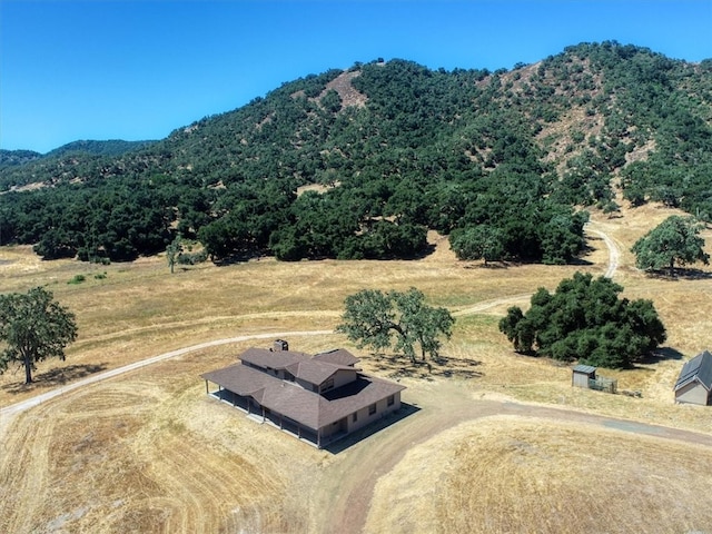 bird's eye view featuring a mountain view and a rural view