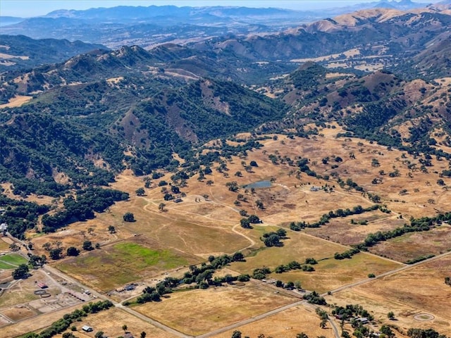 birds eye view of property featuring a mountain view