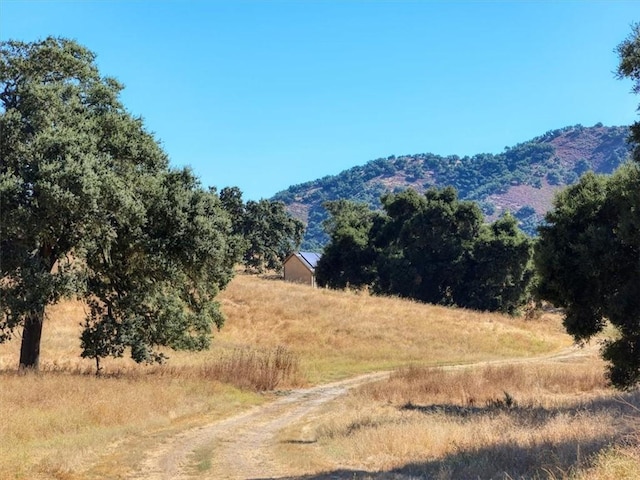 view of mountain feature with a rural view