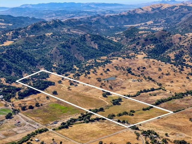 birds eye view of property featuring a mountain view