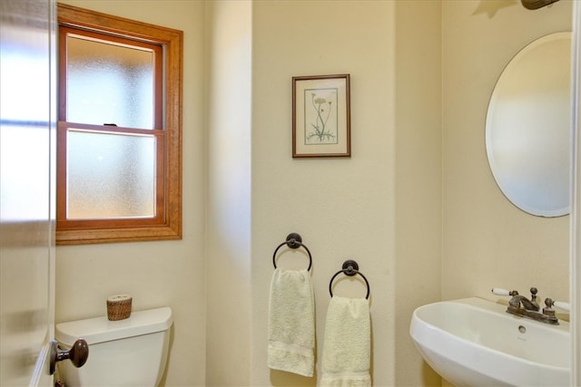 bathroom featuring a sink and toilet