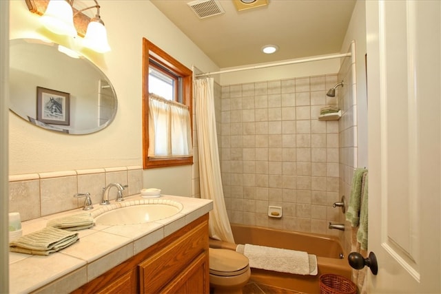 full bath with tasteful backsplash, visible vents, toilet, shower / bath combo, and vanity