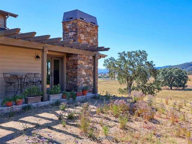 exterior space featuring a mountain view