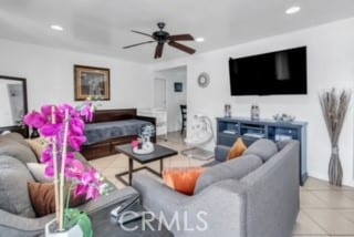 living room with light tile patterned flooring and ceiling fan