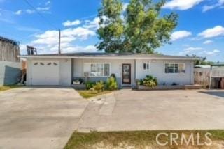 234 E Raymond St, Compton, CA 90220 - ranch-style house with an attached garage and driveway
