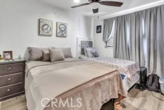234 E Raymond St, Compton, CA 90220 - bedroom featuring light wood-style flooring and a ceiling fan