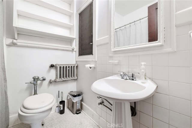 bathroom with tile patterned floors, decorative backsplash, tile walls, and toilet