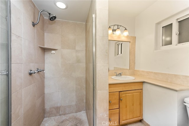 bathroom with vanity and an enclosed shower