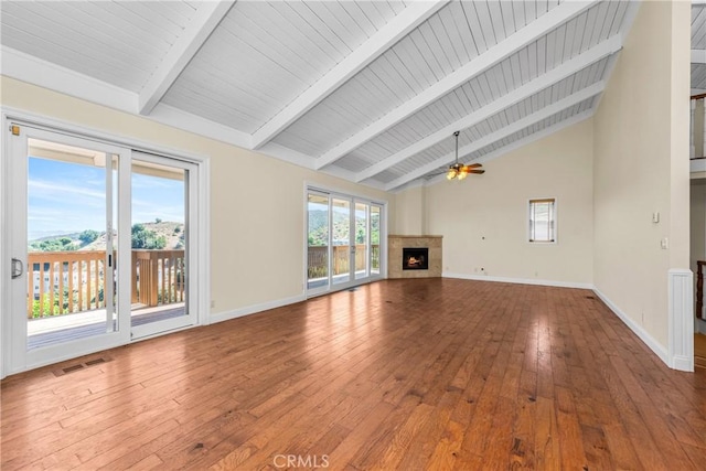 8462 Hillcroft Dr, West Hills, CA 91304 - unfurnished living room with a ceiling fan, beamed ceiling, wood-type flooring, high vaulted ceiling, and a lit fireplace