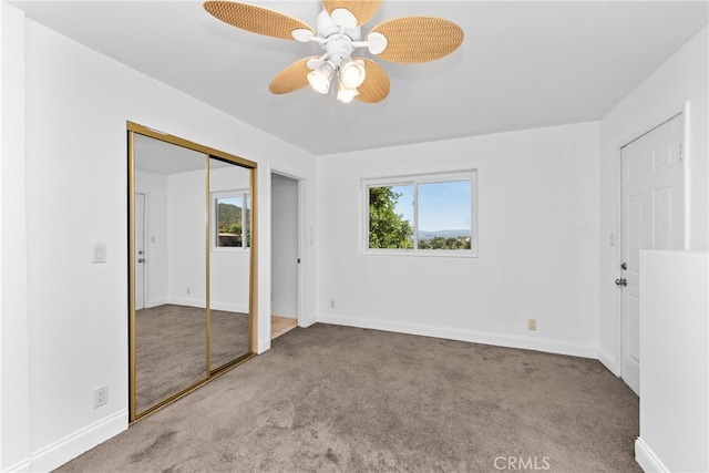 unfurnished bedroom with ceiling fan and light carpet