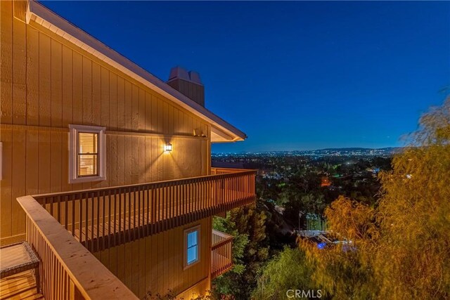 8462 Hillcroft Dr, West Hills, CA 91304 - property exterior at night with a chimney and a balcony