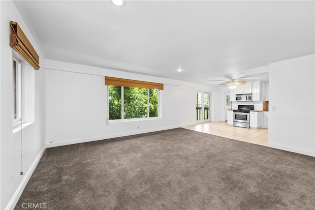 8462 Hillcroft Dr, West Hills, CA 91304 - unfurnished living room with light carpet, a ceiling fan, and recessed lighting