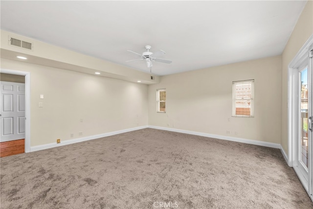 unfurnished room featuring carpet flooring and ceiling fan