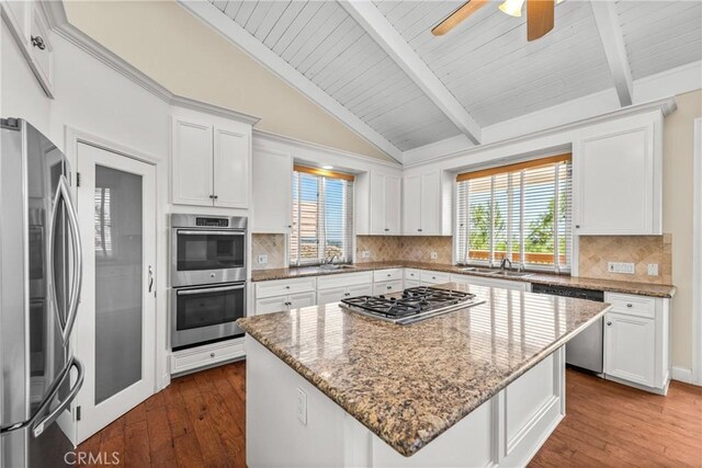 8462 Hillcroft Dr, West Hills, CA 91304 - kitchen with appliances with stainless steel finishes, plenty of natural light, white cabinets, and wood ceiling