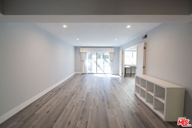 unfurnished living room featuring hardwood / wood-style floors