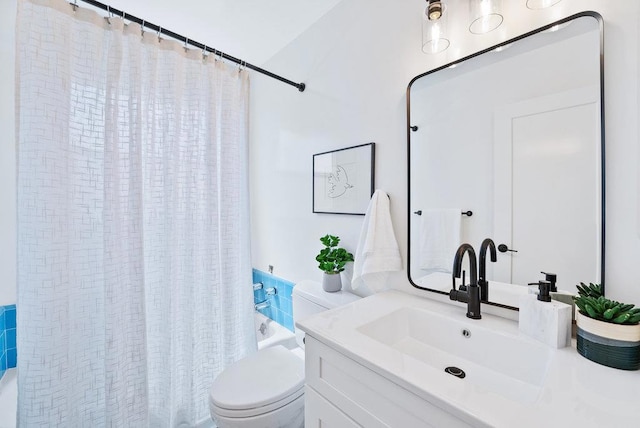 full bathroom with vanity, shower / tub combo, and toilet